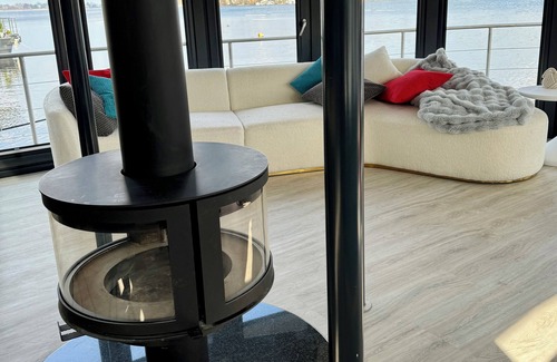 Werder Boat Rental | Luxury Floating Home Shanti 2 with fireplace & lakeside sauna