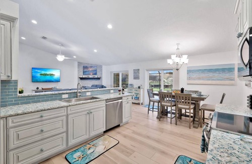 Pelican House | Luxury Gulf Access Pool Home With Large Tiki Hut Close to Tarpon Point Marina