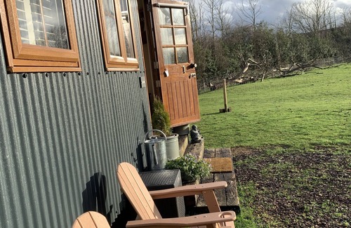 Coalpit Heath Ski Chalet | Luxury heated shepherd's hut in field location.