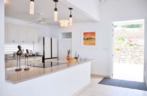 Bolans Villa | Luxury hillside family retreat set in 3/4 acre tropical garden stunning views