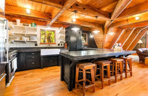 Serene Lakes House | Luxury lakefront home with private hot tub, on-site dock, fireplace & HOA beach