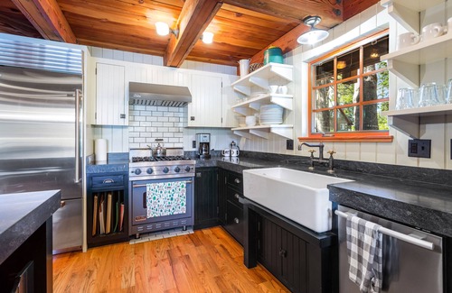 Serene Lakes House | Luxury lakefront home with private hot tub, on-site dock, fireplace & HOA beach