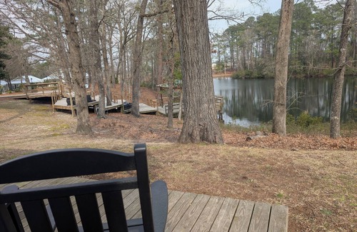 Elizabethtown Resort | Luxury Lodging, Lakefront View, King Bed w/Private Bath, Private Patio.