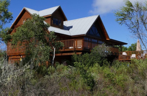 Wilderness House | Luxury log home with lake and mountain views, close to world-class golf courses