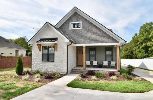 Gastonia House | Luxury New Construction Cottage with fireplace, office, and covered deck