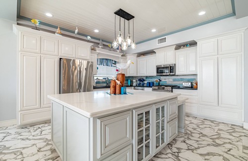 San Pedro House | Luxury Oasis: Serene Beachfront with Pool & Dock
