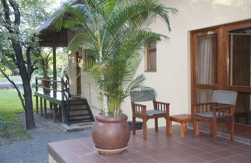 Phalaborwa Villa | Luxury Villa 1 km from Kruger Park veranda overlooking the garden and ponds