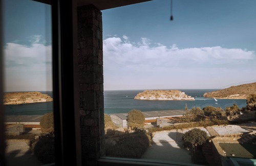 Elounda Villa | luxury villa in front of a historic famous island