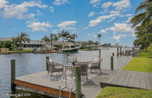 Cocoa Beach House | Luxury Waterfront -Heated Pool, Dock, Bikes & Paddleboards - Mins to Beach