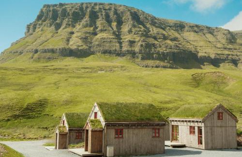 Gasadalur House | Múlafossur Cottages by famous waterfall in Gásadalur