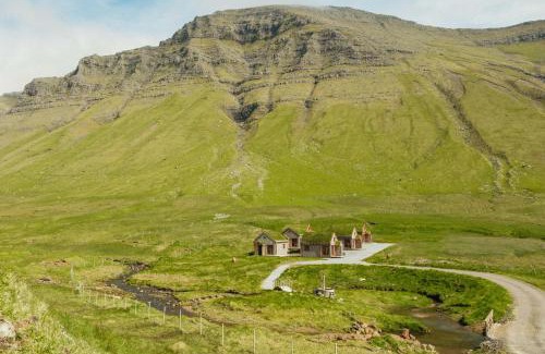 Gasadalur House | Múlafossur Cottages by famous waterfall in Gásadalur