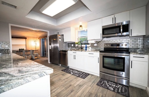 Hampton Homes House | Marlin on Merritt Pool House featuring Private Game Room, Mini Golf & Fire Pit!