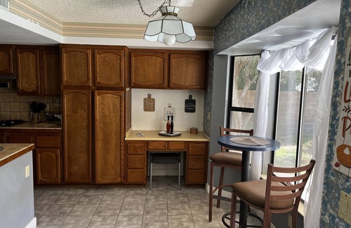 Paradise House | Master Bedroom and bath in a Vegas home with pool & 7 minutes to the stripn