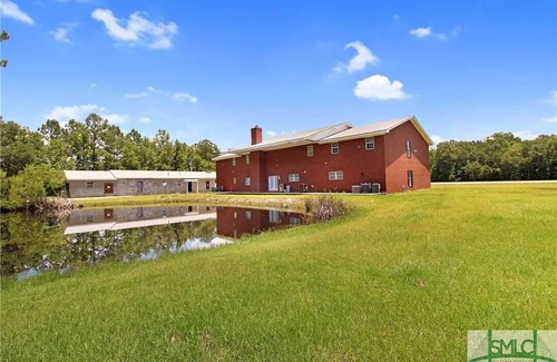 Fleming House | Midway Manor Awaits You with 7 bedrooms, 5 Bathrooms, and Unlimited Charm