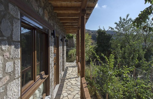 Arachova Apartment | Milia Room. Spacious and autonomous, ideal for a couple.