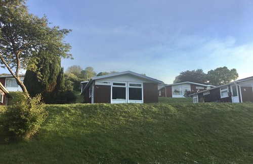 Llanybri Ski Chalet | Milkwood, A lovely Three-bedroomed chalet, sleeps five