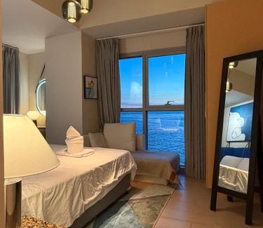 Tambo Apartment | Modern 1BR with Balcony Facing Infinity Pool Manila Bay Sunset Near Airports OKADA Solaire MOA