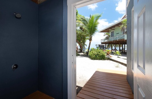 Roatan House | Modern 2 Bedroom Beachfront Home - Steps from the Sea w/Patio, Shared Pool&Dock