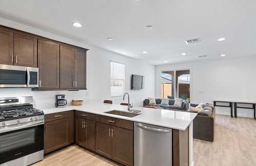 Goodyear House | Modern 3BR/2BA home in Goodyear with a community pool, pickleball courts, and EV charger! Less than a mile from Goodyear baseball stadium and close to other major venues, shopping, and golf courses!