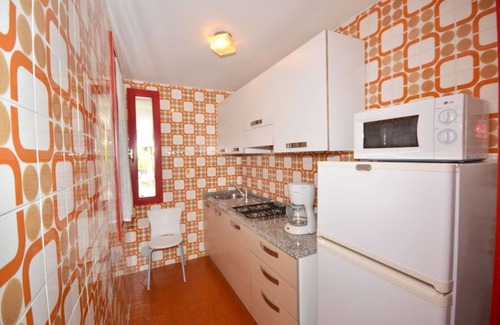 Lignano Sabbiadoro Apartment | Modern and fully equipped four room apartment with pool