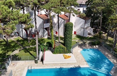 Lignano Sabbiadoro Apartment | Modern and fully equipped four room apartment with pool