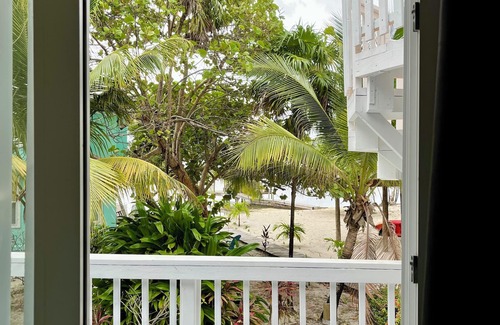 Roatan Cottage | Modern Beachfront Home - Steps from the Sea w/Patio, Shared Pool & Dock