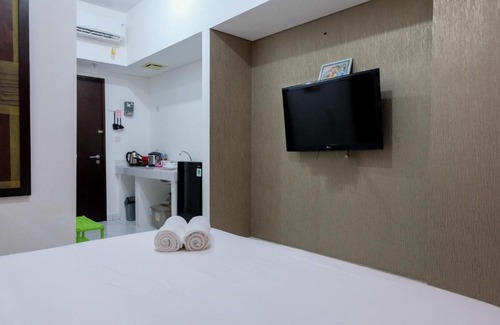 Pagedangan Apartment | Modern & Comfy Studio @ Casa De Parco Apartment By Travelio