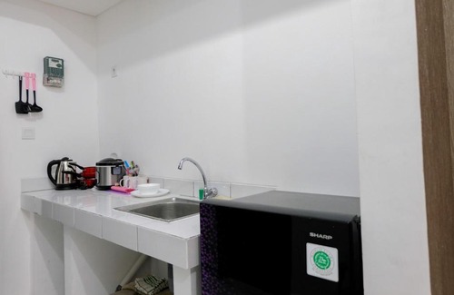Pagedangan Apartment | Modern & Comfy Studio @ Casa De Parco Apartment By Travelio