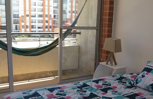 Girardot Condo | Modern Elegance | Gem with Balcony and Four Pools