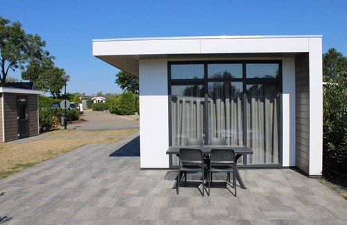 Lathum House | Modern holiday home with a view of a tranquil pond