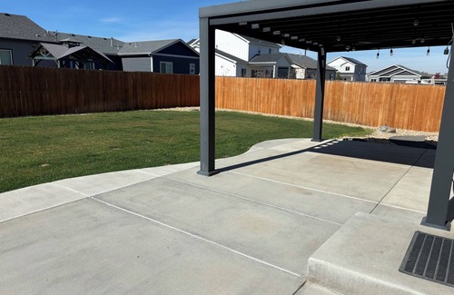 Milliken House | Modern home with a large fenced yard, and garage access