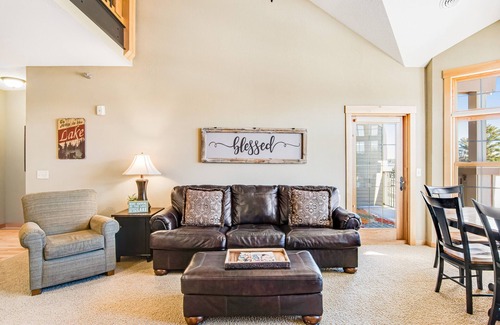 Three Lakes Condo | Modern, lake-view condo with loft, balcony, fireplace, pool & hot tub access