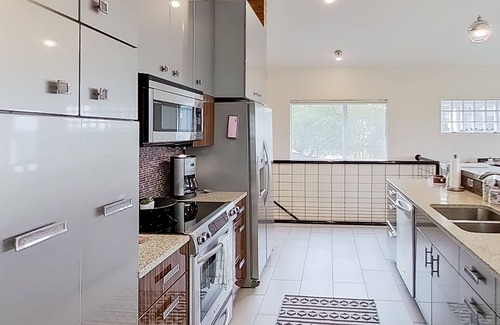 Lago Vista House | Modern lake-view retreat with balcony, deck, Peloton, central AC, & washer/dryer