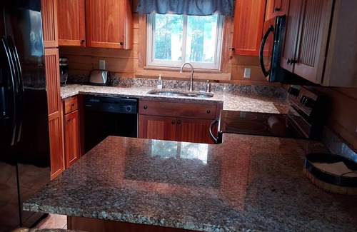Oakland Cabin | Modern lakeside log cabin on pristine East Pond Oakland Maine's Belgrade Lakes