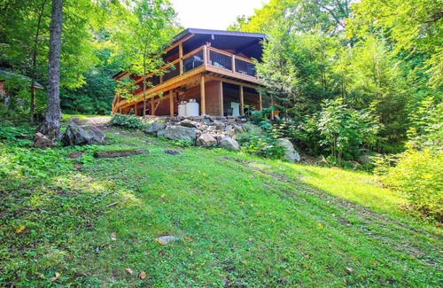 Dysart et al Cottage | Modern log cabin with wrap around deck on Little Kennisis