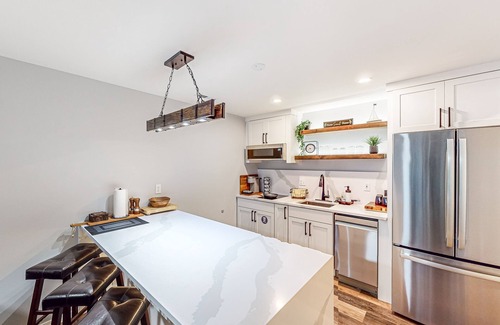 The Wedge House | Modern lower-level getaway with a fireplace, inviting patio & washer/dryer