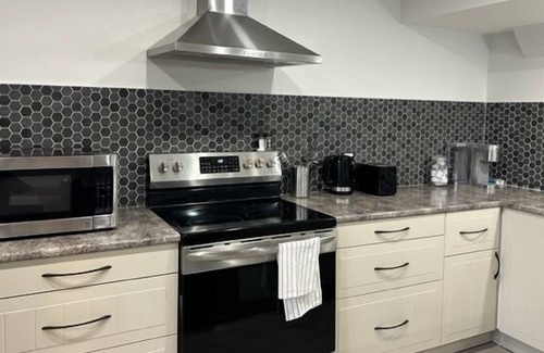 Southeast Calgary House | Modern Mahogany Suite