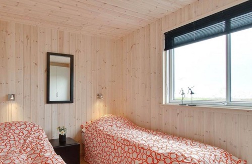 Harboore House | Modern pool house for large group with a view of the Ferringsee
