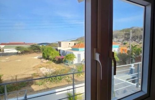 Tera Kora Apartment | Modern sunshine yellow apartment with nature views