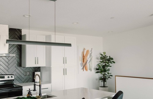 Des Moines House | Modern Townhome with Skyline Views, Heated Balcony & Curated Art in Downtown DSM