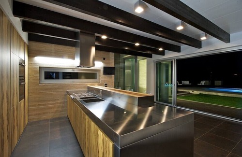 Frisa Villa | Modern villa with swimming pool surrounded by greenery