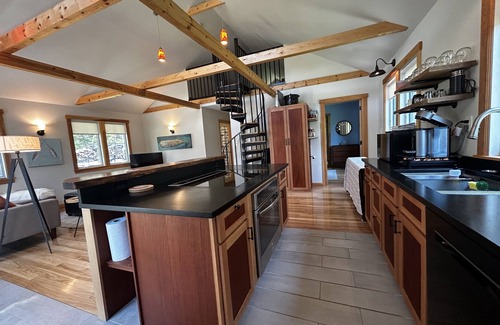 Isle of Springs Cottage | Modern woodland privacy with ocean, trails, and lobster all in walking distance.