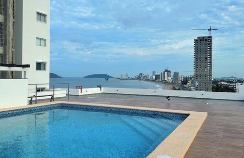 Mazatlan Condo | New modern 2 bed 2 bath condo steps away from the beach with rooftop pool deck!