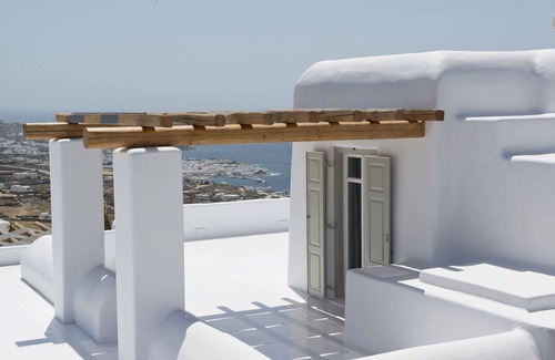 Tourlos Villa | My Rental Homes - Villa Opallia with spacious living and dining areas and a pool