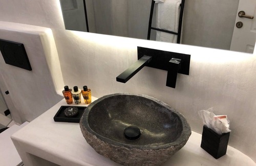 Platis Gialos Apartment | Mykonian Mews H1 Luxury Cave Suite with outdoor jacuzzi, lounge and cuisinette