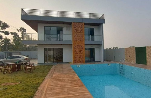 Kolkata Villa | Nature Villa With Grand Pool with four double bed rooms.
