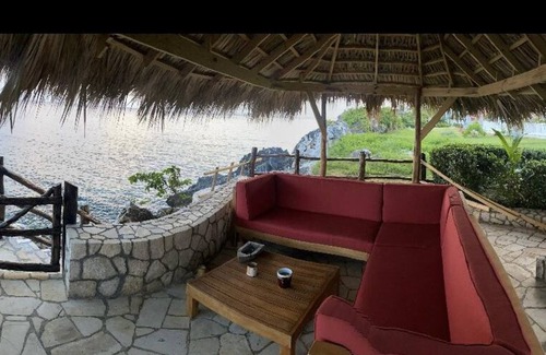 Orange Bay House | Negril Bungalow Paradise overlooking cliffs with Private Snorkeling Entrance.
