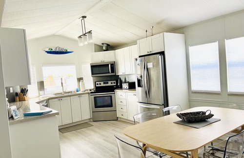 Hutchinson Island South Cottage | Nettles Island Waterfront with Dock & steps from Beach-plus Golf Cart Credit