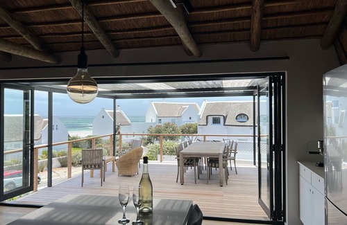 Kommetjie House | New and gorgeous Beach House with Hot Tub steps from Long Beach's surf breaks