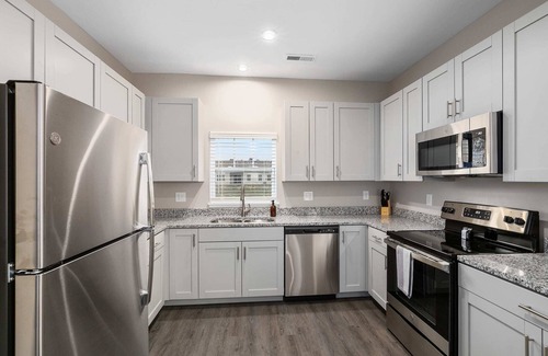 Grandville Condo | New Build 4BR 4BA Two Condo w Garage and Patio